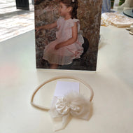 Vincha elastica ivory strass ponpon